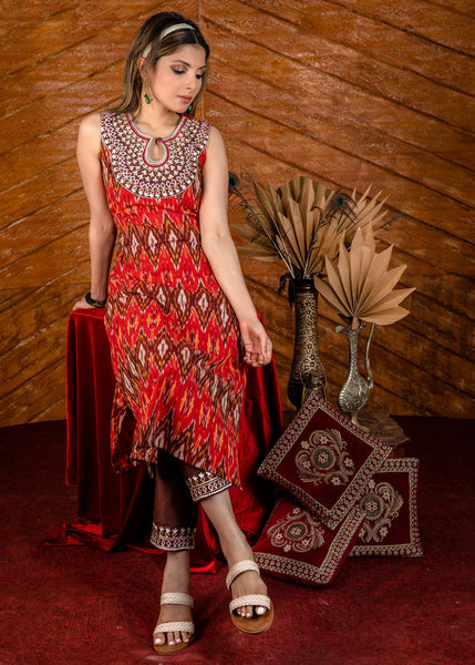 Exclusive sleeveless ikat kurta with heavy hand embroidery on neckline.