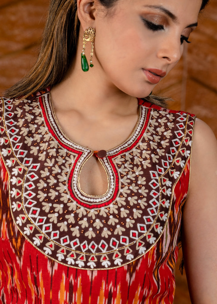 Exclusive sleeveless ikat kurta with heavy hand embroidery on neckline.