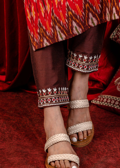 Exclusive sleeveless ikat kurta with heavy hand embroidery on neckline.