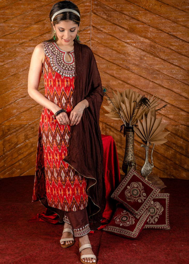 Exclusive sleeveless ikat kurta with heavy hand embroidery on neckline.