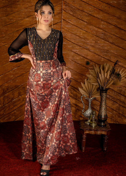 Exclusive mashuru silk block printed Ajrakh gown with hand embroidered yoke.
