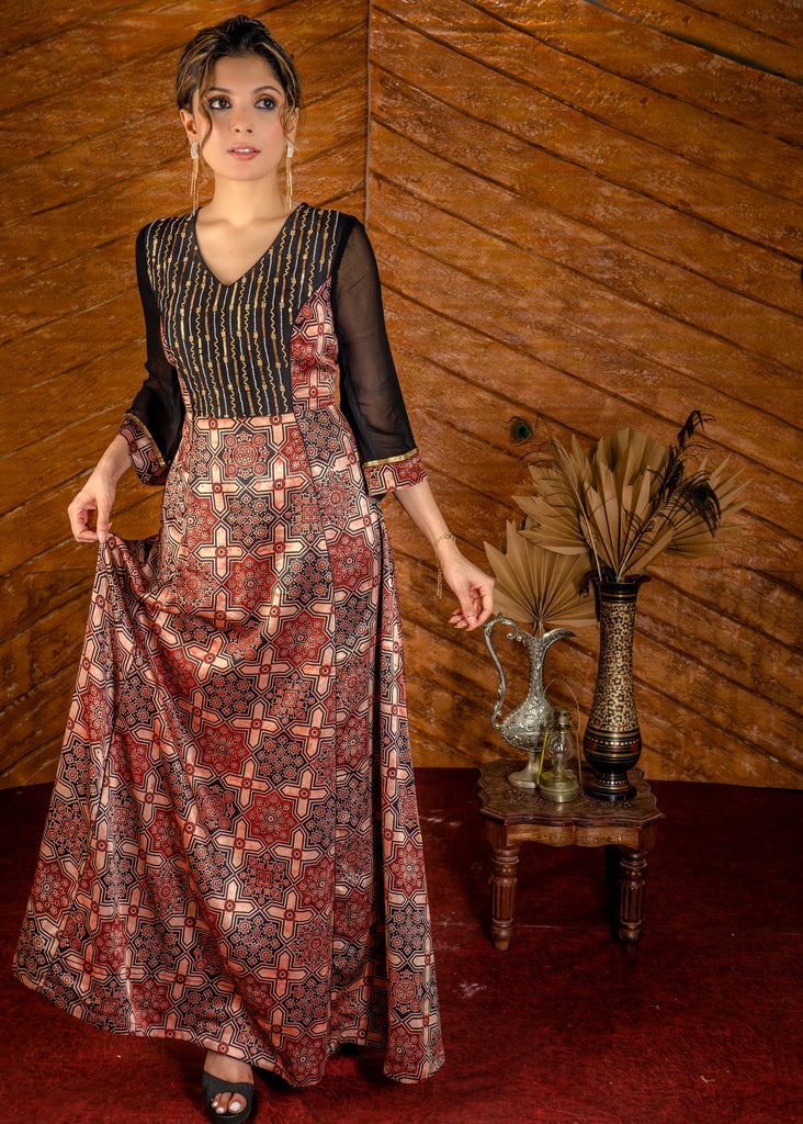 Exclusive mashuru silk block printed Ajrakh gown with hand embroidered yoke.