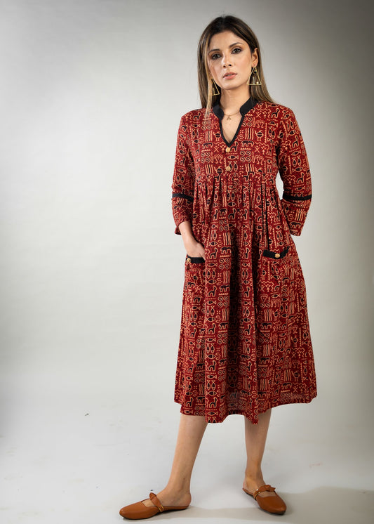 Red colour printed Ajrakh dress with black detailing & pockets