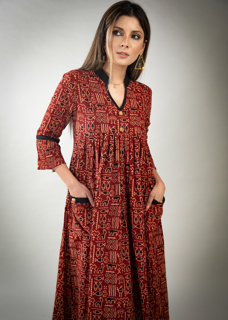 Rust colour printed Ajrakh dress with black detailing & pockets