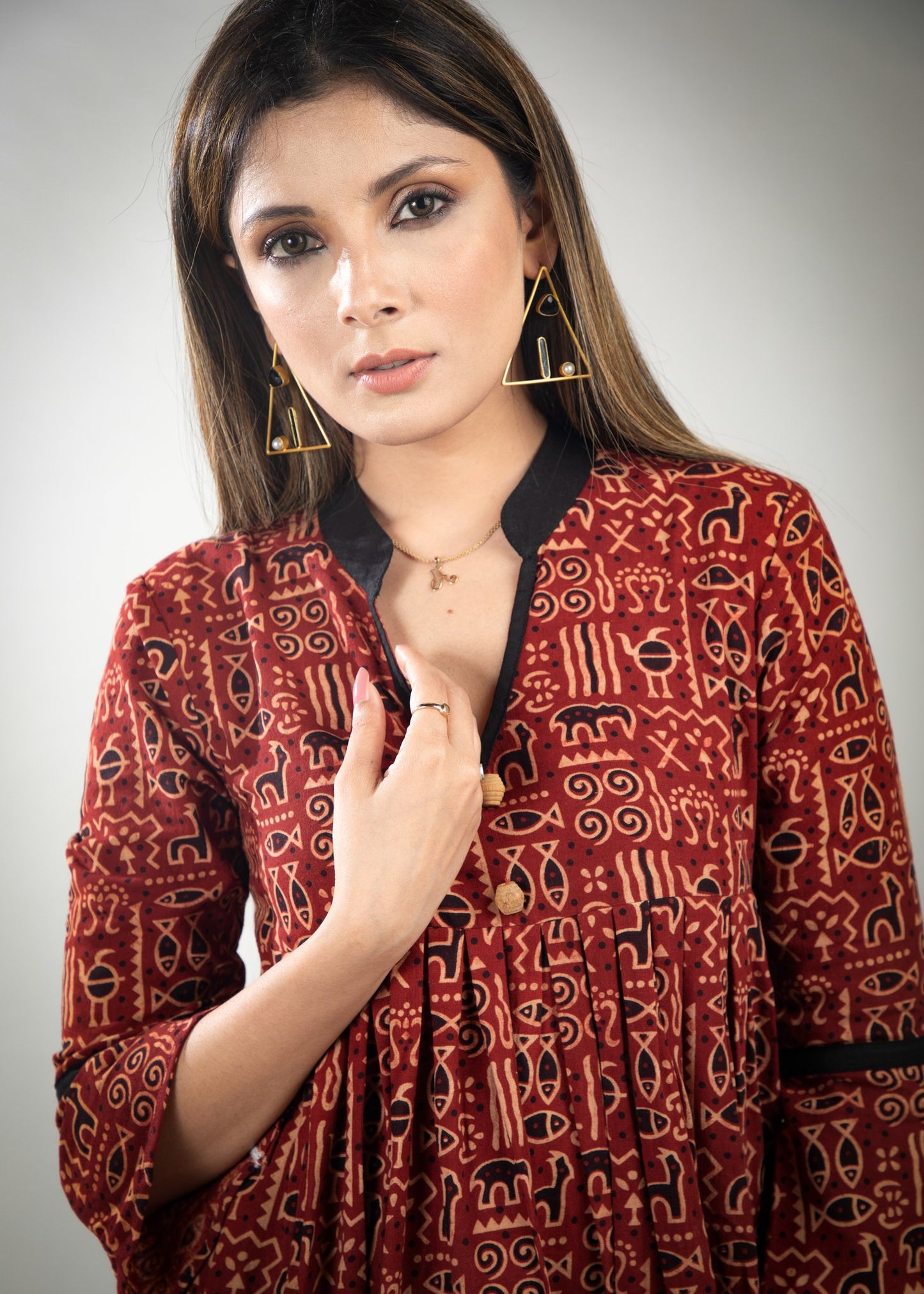 Red colour printed Ajrakh dress with black detailing & pockets