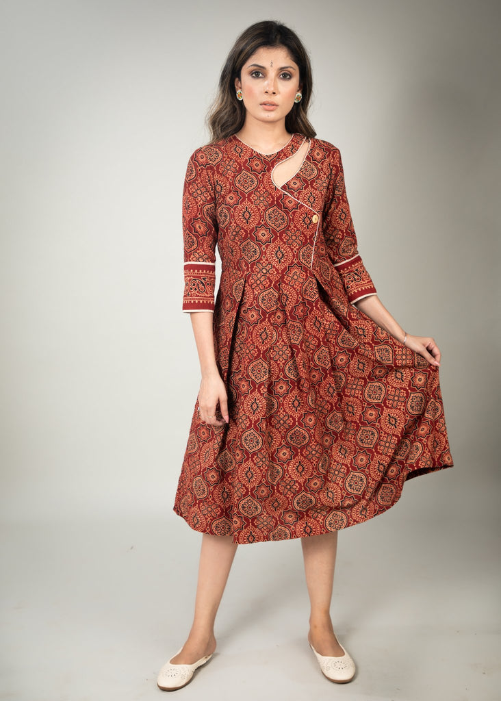 Rust Ajrakh printed dress with asymmetrical neckline & contrast detailing