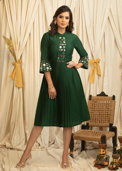 Exclusive forest green dress with mirror work & pleated skirt
