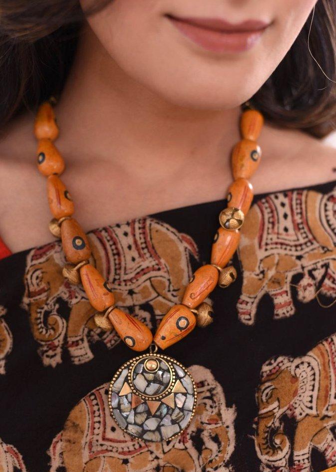 Exclusive wooden beads necklace with ceramic pendant