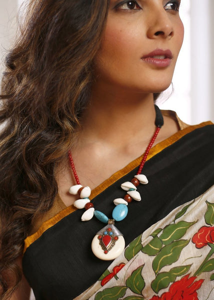 Exquisite pendant from ladakh with turquoise stone & cowrie shell necklace
