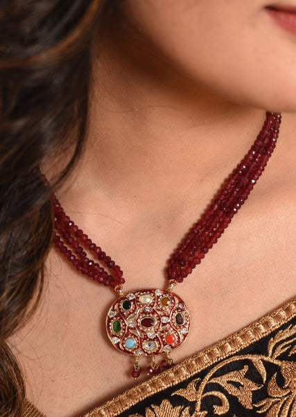 Maroon semi precious stone necklace with exquisite Jaipuri work pendant