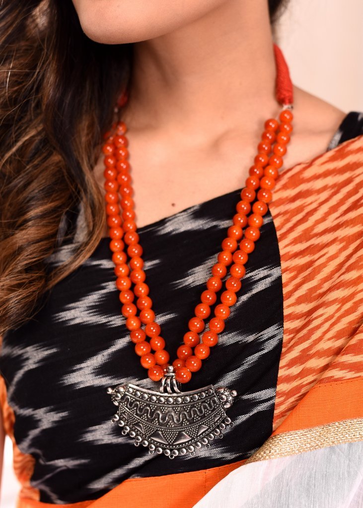 Orange glass beaded necklace with german silver pendant