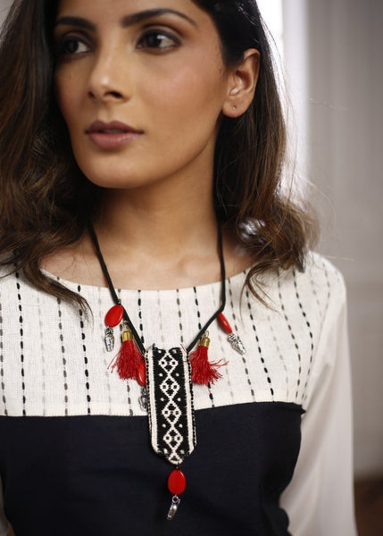 Tribal monochrome woollen hand weaved pendant combined with red beads, german silver  and tassels