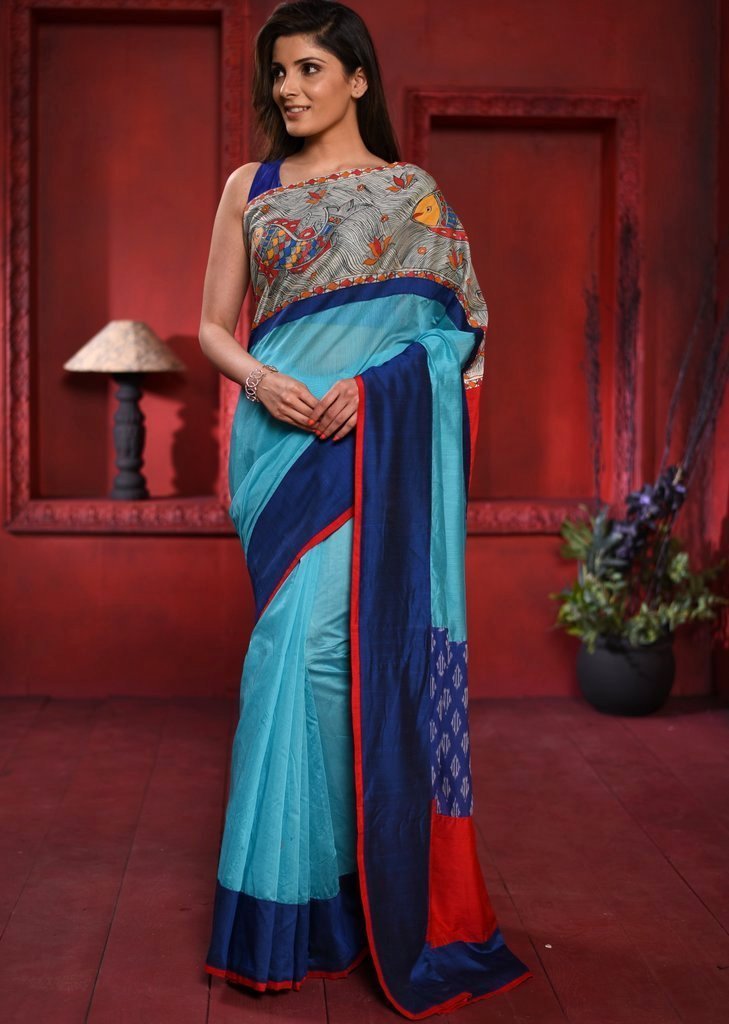Blue chanderi saree with hand painted madhubani work in front & ikat patch on pallu