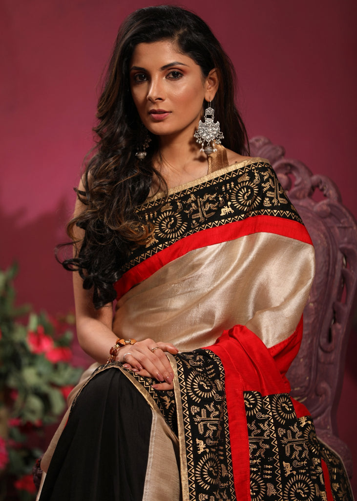 Combination of pure tassar silk and black semi silk saree with warli printed pallu & border