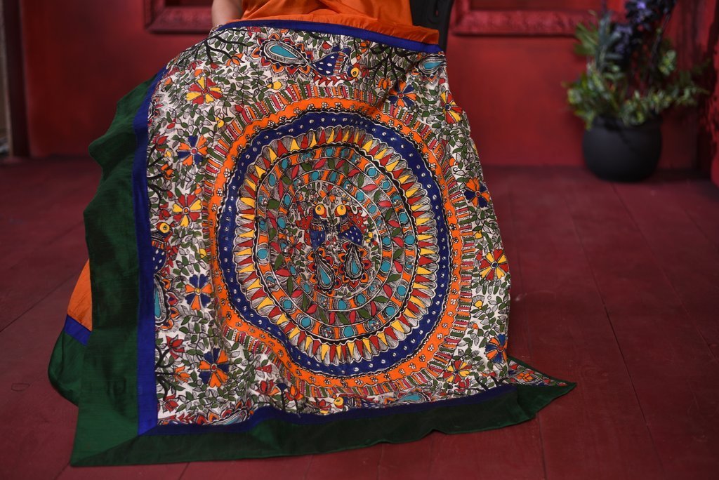 Orange chanderi saree with intricate hand painted madhubani painted pallu & border