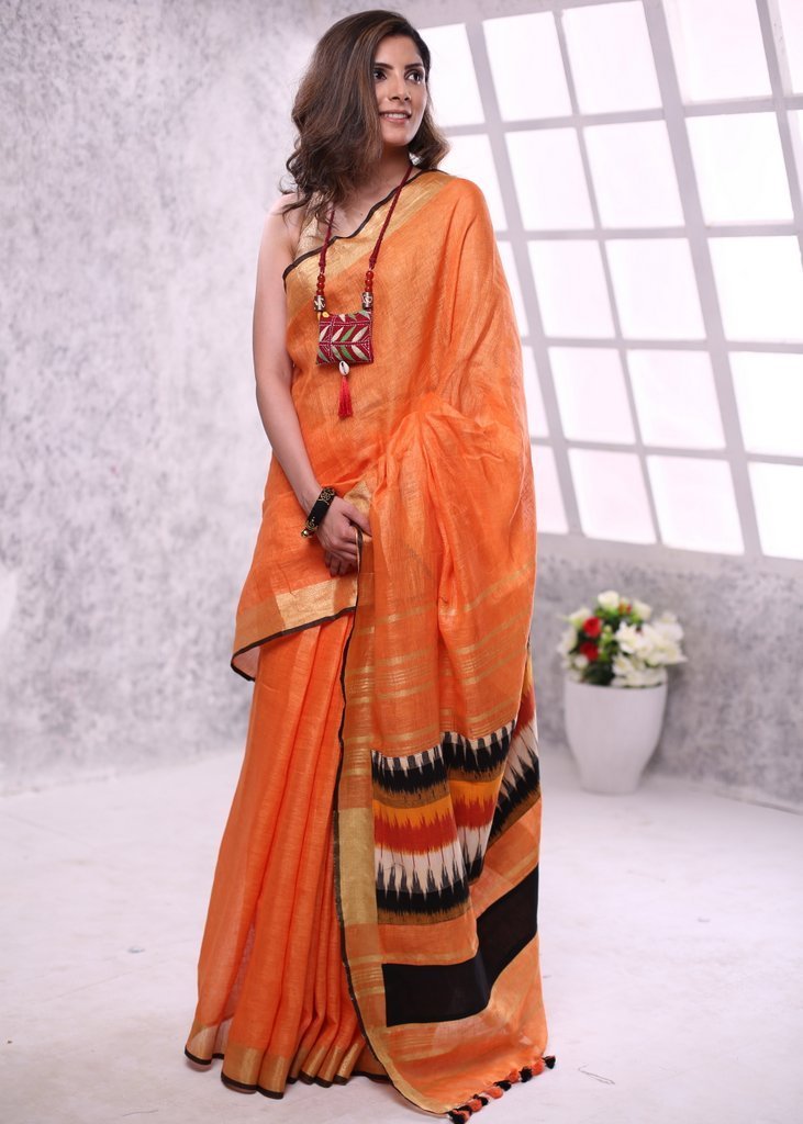 Orange pure linen saree with zari border & ikat patch on pallu